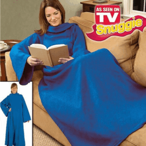 Woman wearing a blue Snuggie while reading on a couch