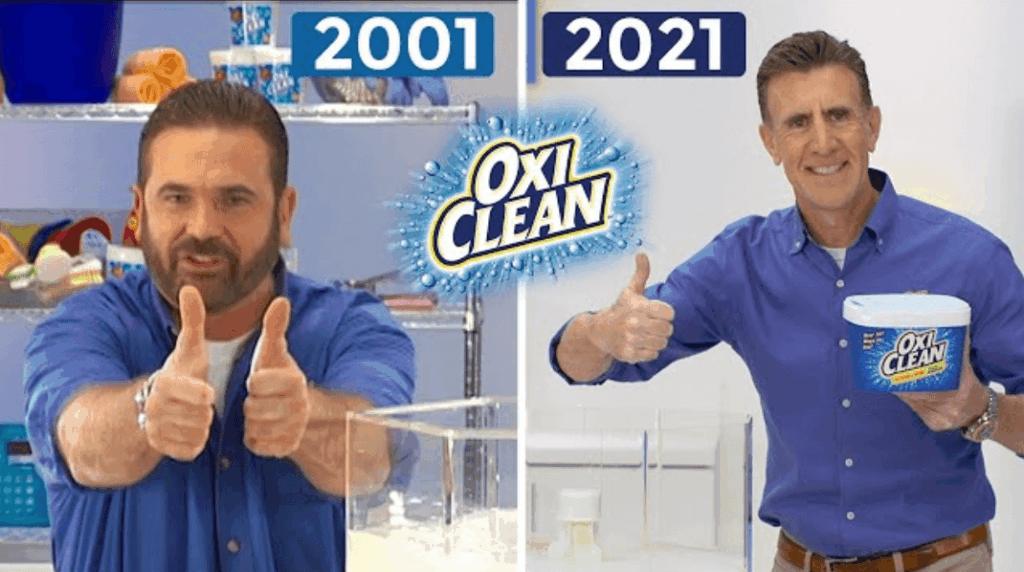 The 2001 and 2021 spokesmen for OxiClean side by side holding the product